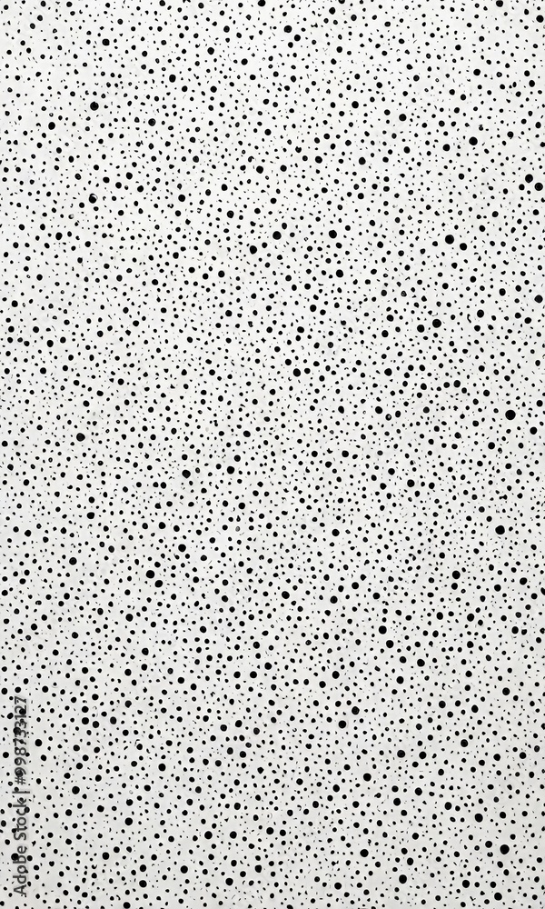 Aufkleber a close-up view white surface with a pattern of black dots, resembling a speckled or speckled textur