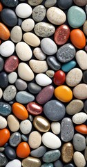 A close-up image of a variety of colorful pebbles and stones arranged in a visually appealing pattern against a dark background.