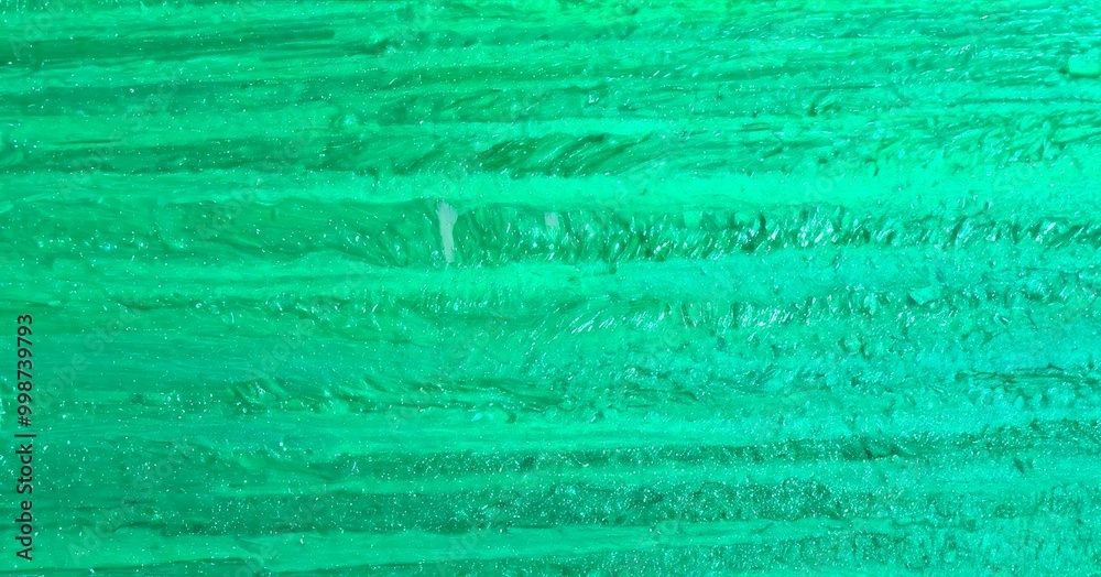 Poster a close-up view textured surface with a vibrant green color, resembling a natural or organic pattern