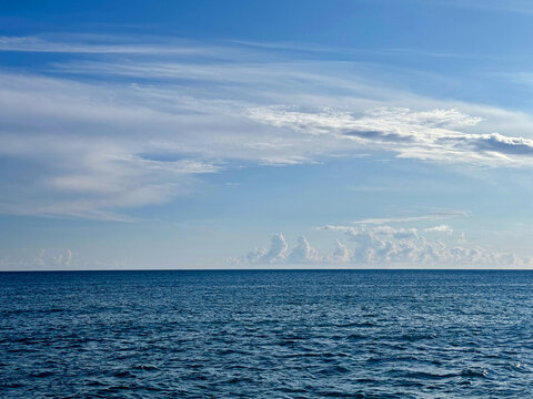 Blue ocean waves and beautiful sky clouds 