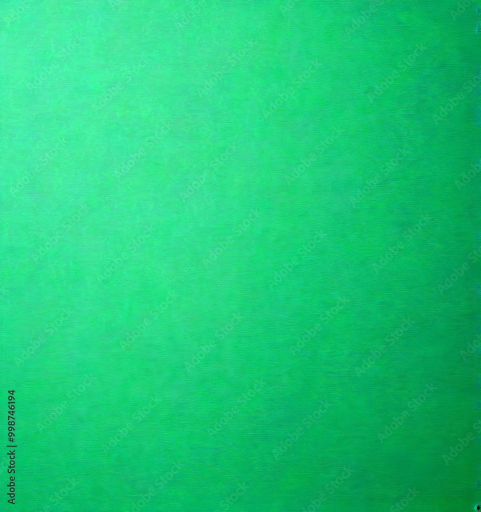 Aufkleber a close-up view of a vibrant green surface, which appears to be a piece of paper or a similar materi