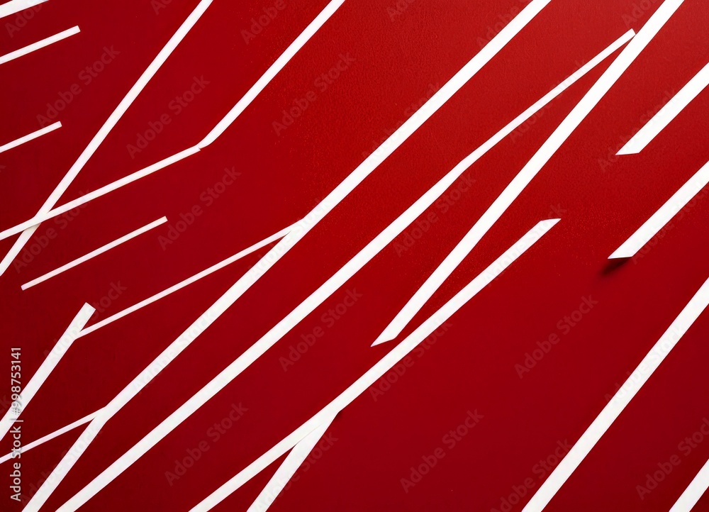 Aufkleber a close-up view red background with white diagonal lines intersecting at various angles, creating a dynamic and abstract visual effect