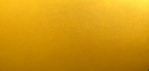 Fototapeta premium a close-up gold-colored surface, possibly a wall or a piece of furniture, with a subtle texture and a gradient effect