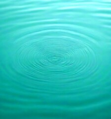 Fototapeta premium a close-up view calm body of water, with concentric ripples forming a circular pattern The water appears to be a light blue-green color, and taken from