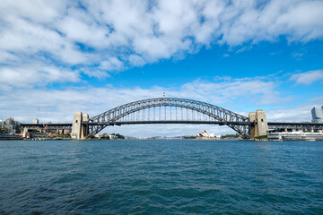 View of Sydney Harbour Bridge from ferry with Sydney Opera House in the background