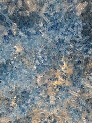 Large pile of crushed blue plastic bottles