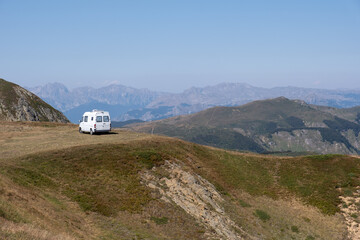 White camper van parked on top of the mountain with a great view over the valleys in Biogradska...
