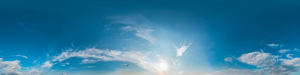Sky 360 panorama - Bright blue sky filled with fluffy white Cirrus clouds. Seamless hdr spherical 360 panorama. Sky dome sky replacement for aerial drone 360 panoramas. Weather and climate change