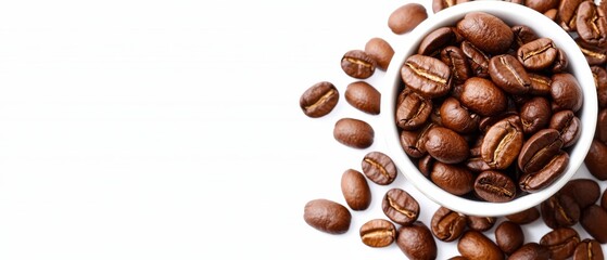 Fototapeta premium A white table holds a bowl filled with coffee beans, while nearby rests an additional pile of roasted coffee beans