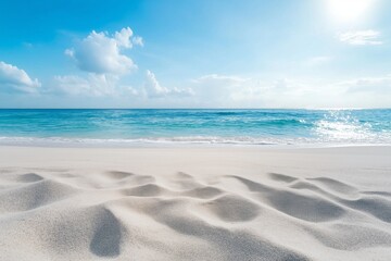 A picturesque tropical beach with clear blue waters and white sandy shores under a bright, sunlit sky.