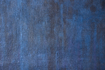 burlap background painted with colored paint in blue