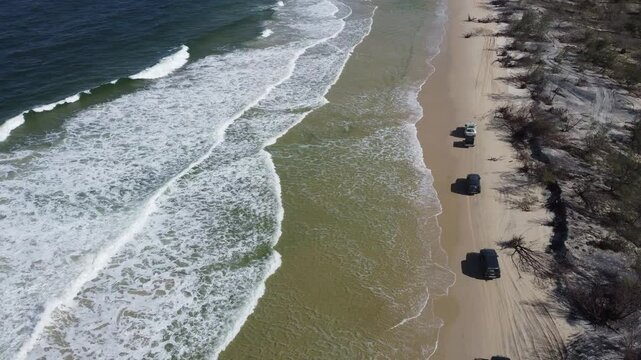 4WD Driving on Fraser Island Beach - Aerial Drone Footage of Australia's Iconic Sand Dunes Island