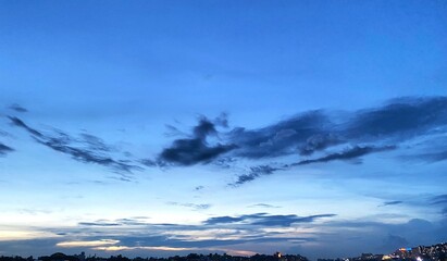 Sunset over the city view, Beautiful evening sunset in the city, Landscape view of silhouette city in golden hour twilight sky before sunset
