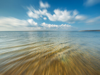 Seaview with clouds in sky in motion and zooming effect