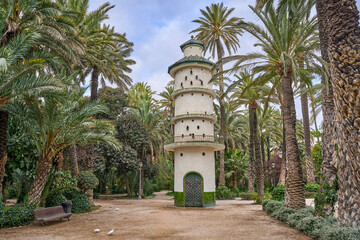 The dovecote tower in the Municipal Park of Elche. In the palm grove in elche, Valencian Community , Alicante, Spain