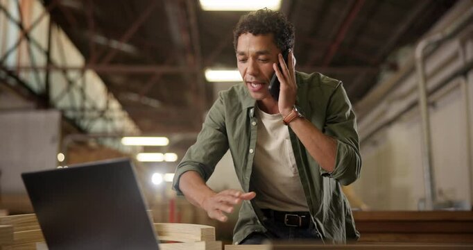 Carpenter, phone call and man in workshop with stress for manufacturing, furniture and order mistake. Carpentry, lumber factory and upset person talking on smartphone with client for timber business