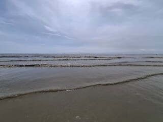 The photo shows Shoreline of Cox's Bazar Sea Beach, Bangladesh
