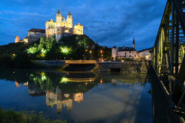 Melk Abbey Stift Melk Austria at night with reflection in the water of melk river and lifting bridge