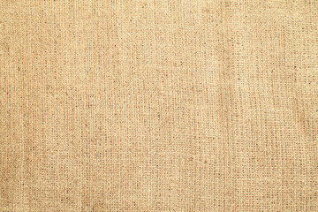 Fototapeta premium Natural Linen Material Textile Canvas Fabric Texture Background Close-up Detail of Fabric Natural Color Hemp Material Pattern Design Wallpaper. Can be Used as Background or For Graphic Design 
