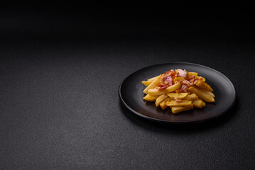 Crispy French fries with pieces of bacon, salt and spices