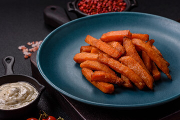 Delicious crispy sweet potato fries with salt, spices and herbs