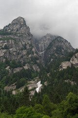 A majestic mountain with a cascading waterfall.