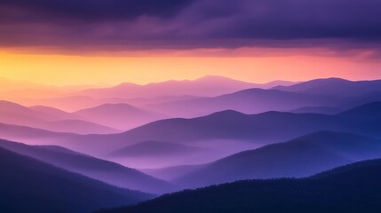 Fototapeta premium Misty Mountain Ranges at Sunset with Purple and Orange Hues