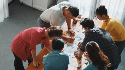 Close up of developer team using mind map to brainstorm idea. Top view of skilled group of business...