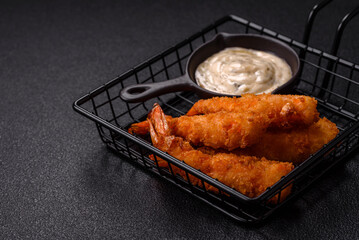 Hot crispy shrimp breaded with salt and spices with white sauce