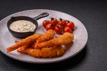 Hot crispy shrimp breaded with salt and spices with white sauce
