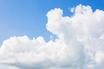 The sky is a beautiful shade of blue adorned with white clouds in it