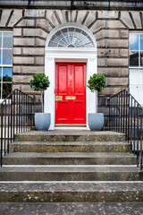 A house with Georgian door at Stockbridge suburb in Edinburgh, UK.