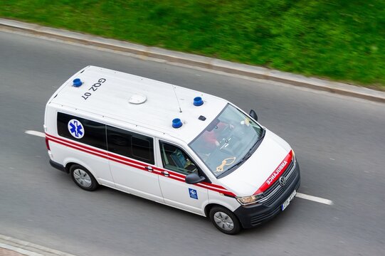 White Volkswagen Transporter T6 ambulance car in Ostrava, Czech Republic with motion blur effect