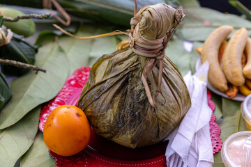 Chicken juane wrapped in bijao leaves. Peruvian jungle food, in all its varieties. Feast of San...