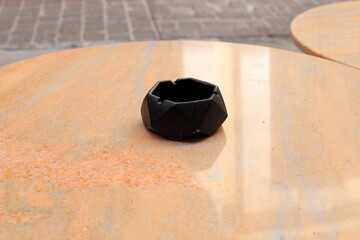 Ashtray for cigarettes and ash when smoking.