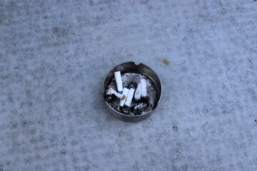 Ashtray for cigarettes and ash when smoking.