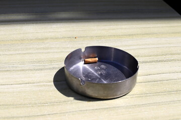 Ashtray for cigarettes and ash when smoking.