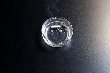 Ashtray for cigarettes and ash when smoking.