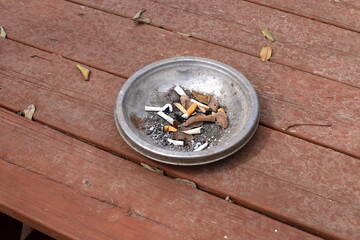 Ashtray for cigarettes and ash when smoking.