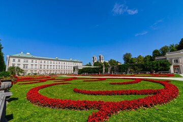 Fototapeta premium The splendor of red and green representing baroque in gardens, Salzburg, Austria