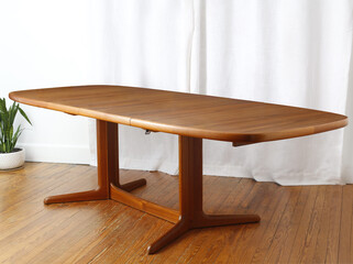 Vintage teak dining table. Teak grain on the tabletop. Interior product photograph jpg.