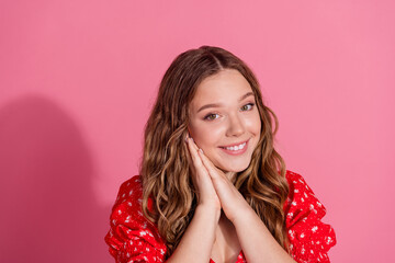 Photo portrait of pretty teen girl dreamy charming wear trendy red outfit isolated on pink color background