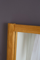 Pair of Brutalist-style oak-framed mirrors. Minimalist home decor. Interior product photograph.