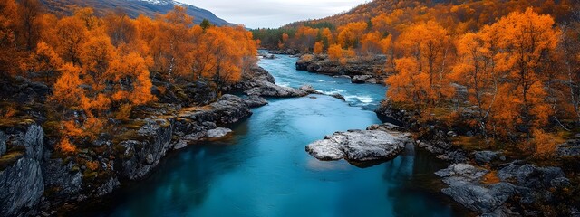 The deep blue water of the lake is surrounded by high cliffs and orange trees, with autumn colors