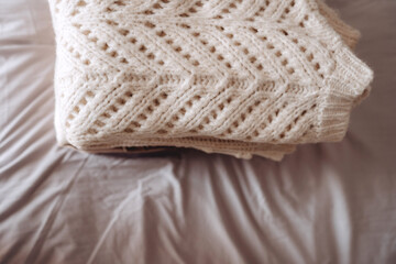 Folded Cozy Knit Sweaters on Bed