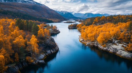 The deep blue water of the lake is surrounded by high cliffs and orange trees, with autumn colors