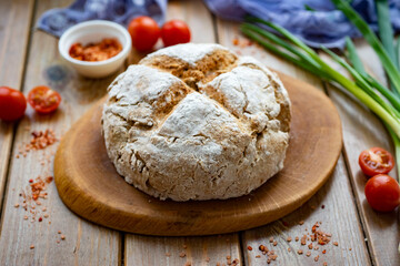 Homemade rye bread on a wooden table. Rye flour bread. Close-up.