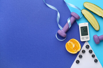 Glucometer with dumbbells, ribbon and food on color background. Diabetes concept