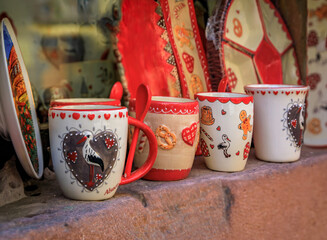 Ceramic mugs with traditional Alsatian designs at a store in Riquewihr, France