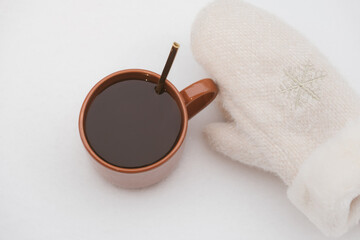 cup of coffee at winter time, cozy atmosphere on the snow